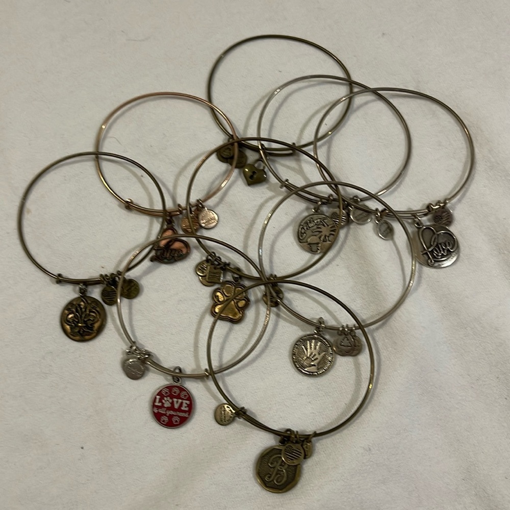 Lot of 9 Alex and Ani Bracelets with charms… good cndt needs a good cleaning